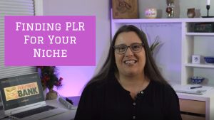 Image of a middle aged woman with brown hair in a black shirt sitting at a desk. The words "Finding PLR For Your Niche" are written on the screen in white letters on a pink background.